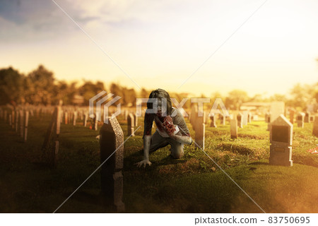 A scary zombie with blood and wound on his body eat the raw meat A scary zombie with blood and wound on his body eat the raw meat 83750695