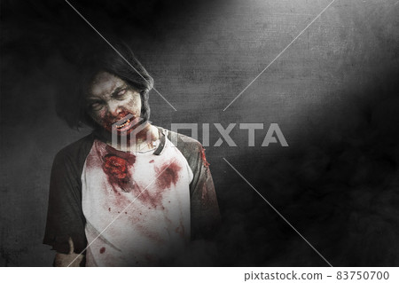 Scary zombie with blood and wound on his body standing 83750700