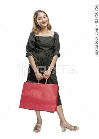 Asian woman carrying shopping bags 83750756