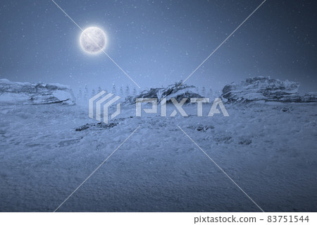 View of a snowy hill with snowfall 83751544