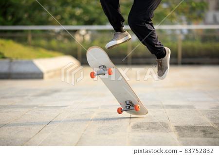 Skateboarder skateboarding outdoors in city 83752832