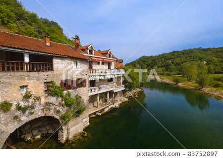 Old Bridge in Rijeka Crnojevica River near Skadar Lake - Montenegro 83752897