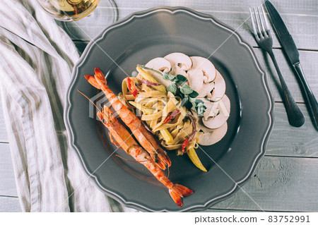 Noodles with shrimp and mushrooms. Spaghetti Noodles with shrimp and mushrooms. Spaghetti 83752991