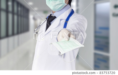 doctor held a mask to the front. 83753720