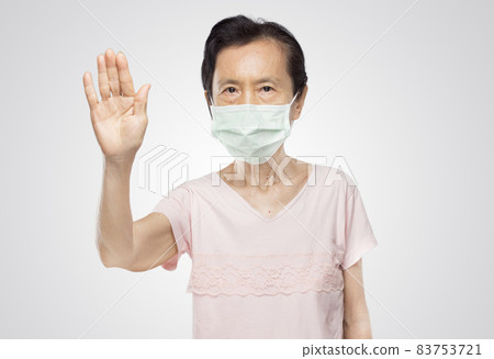 old asian woman wearing mask shows forbidden pose 83753721