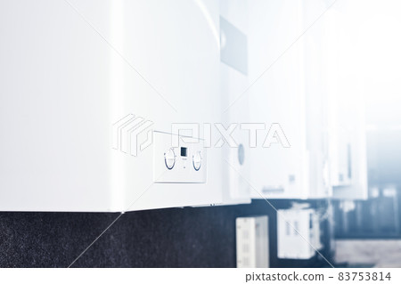 Dual-circuit gas boiler. Gas boiler for home heating. Wall double-bithermic boiler for heating and hot water Dual-circuit gas boiler. Gas boiler for home heating. Wall double-bithermic boiler for heating and hot water 83753814