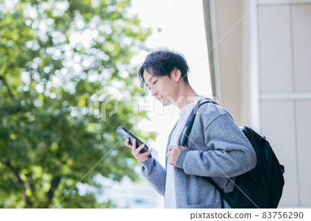 A man carrying a backpack 83756290