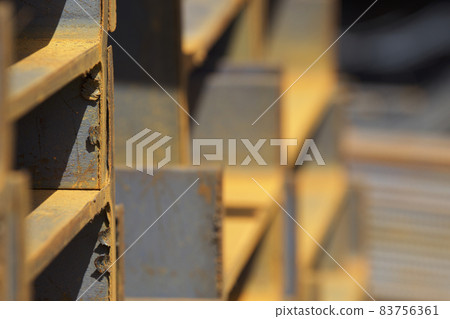 Metal profile beam in packs at the warehouse of metal products 83756361
