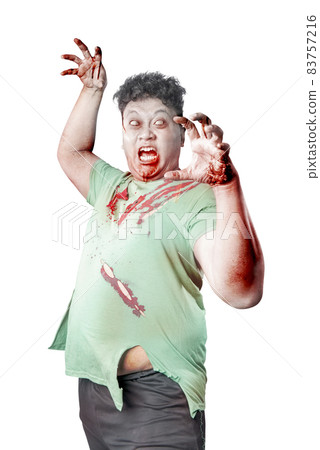 Scary zombie with blood and wound on his body standing 83757216