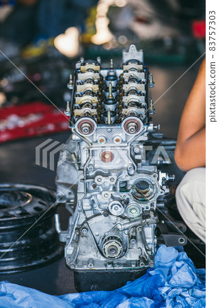 Engine for car repair service. The engine cover was opened. Engine for car repair service. The engine cover was opened. 83757303