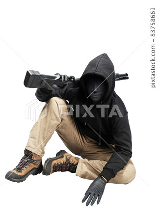 Criminal man in a hidden mask sitting and holding the shotgun Criminal man in a hidden mask sitting and holding the shotgun 83758661