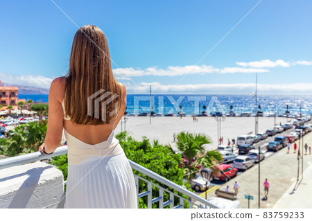 Young woman in white dress standing at the main square of Candelaria, Tenerife Spain Young woman in white dress standing at the main square of Candelaria, Tenerife Spain 83759233