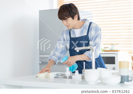 Housekeeping husband cleaning the kitchen Housekeeping husband cleaning the kitchen 83761262
