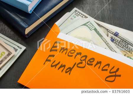 Emergency fund sign on the envelope with money. Emergency fund sign on the envelope with money. 83761603