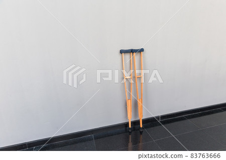 pair wooden crutches or medical walking sticks for rehabilitation of broken leg. pair wooden crutches or medical walking sticks for rehabilitation of broken leg. 83763666