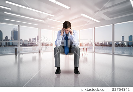 young businessman on chair in office young businessman on chair in office 83764541