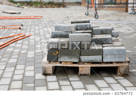 Paving works. Landscaping of the facade of an office building. 83764772