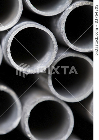 Metal profile pipe of round section in packs at the warehouse of metal products 83764805