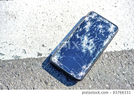 A smartphone with a broken screen when dropped 83766331