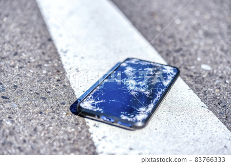 A smartphone with a broken screen when dropped 83766333