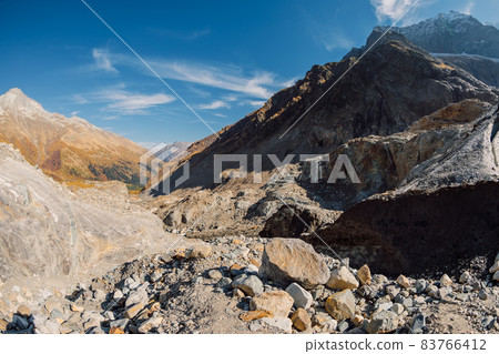 Glacier and high rocky mountains. Peak of mountain and ice glacier 83766412
