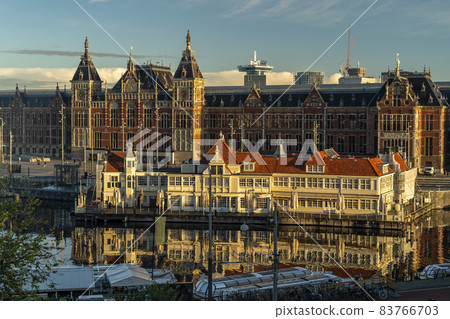 amsterdam central station at sunrise amsterdam central station at sunrise 83766703