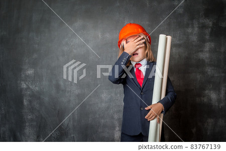 Shocked and surprised little businessman with copy space. Excited amazed shocked or surprised child face. concept for amazement, making a mistake, stunned and speechless or back to school 83767139