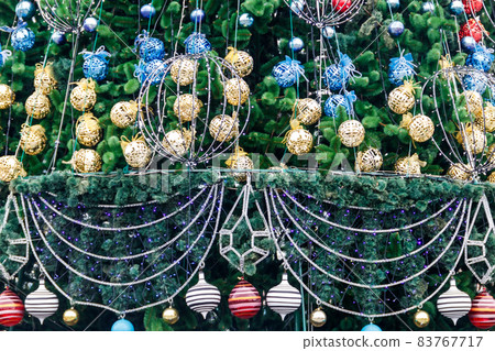 Beautiful Christmas decorations hanging on Christmas tree 83767717