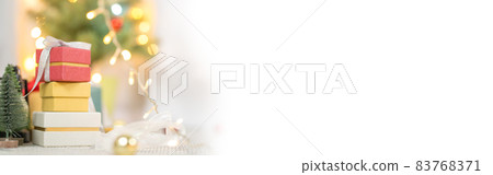 web banner new year gift box with lighting on christmas tree background web banner new year gift box with lighting on christmas tree background 83768371