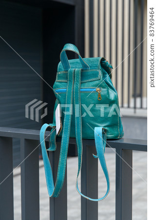 Tiffany leather backpack on the metal fence Tiffany leather backpack on the metal fence 83769464