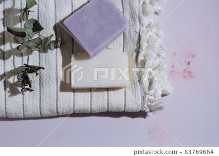 Handmade natural soaps on soft cotton towel on marble background 83769664