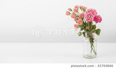 vase with roses table. High quality beautiful photo concept vase with roses table. High quality beautiful photo concept 83769666