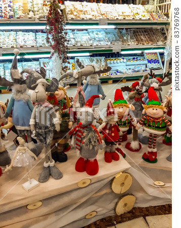 Christmas and New Year's toys in a store. Festive winter Christmas trade Christmas and New Year's toys in a store. Festive winter Christmas trade 83769768