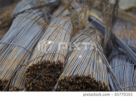 Reinforcing bars with a periodic profile in the packs are stored in the metal products warehouse Reinforcing bars with a periodic profile in the packs are stored in the metal products warehouse 83770101