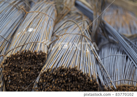 Reinforcing bars with a periodic profile in the packs are stored in the metal products warehouse Reinforcing bars with a periodic profile in the packs are stored in the metal products warehouse 83770102