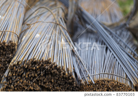 Reinforcing bars with a periodic profile in the packs are stored in the metal products warehouse Reinforcing bars with a periodic profile in the packs are stored in the metal products warehouse 83770103