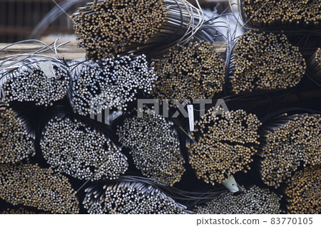 Reinforcing bars with a periodic profile in the packs are stored in the metal products warehouse Reinforcing bars with a periodic profile in the packs are stored in the metal products warehouse 83770105