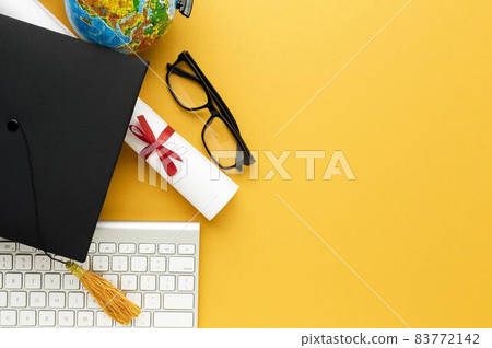 top view academic cap glasses with keyboard. High quality beautiful photo concept top view academic cap glasses with keyboard. High quality beautiful photo concept 83772142