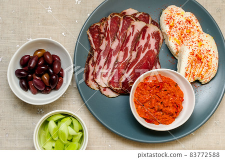 Plate with Bulgarian salami - babek, cheese and chutney 83772588