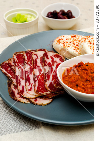 Plate with Bulgarian salami - babek, cheese and chutney 83772590