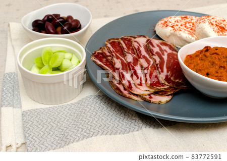 Plate with Bulgarian salami - babek, cheese and chutney Plate with Bulgarian salami - babek, cheese and chutney 83772591