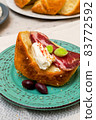A slice of bread with Bulgarian salami, cheese and chutney 83772592