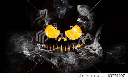 Halloween pumpkin face with burning fire inside. 83773007