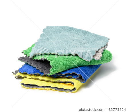 stack of textile multicolored rags for cleaning on a white background 83773324