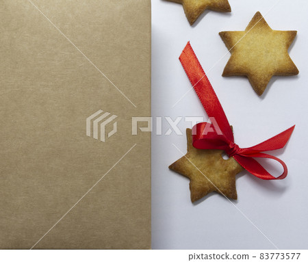 Gingerbread cookies. Natural paper background and white background. Christmas baking background. New Year theme. Merry Christmas and Happy New Year Holidays greeting card, frame, banner, copy space Gingerbread cookies. Natural paper background and white background. Christmas baking background. New Year theme. Merry Christmas and Happy New Year Holidays greeting card, frame, banner, copy space 83773577
