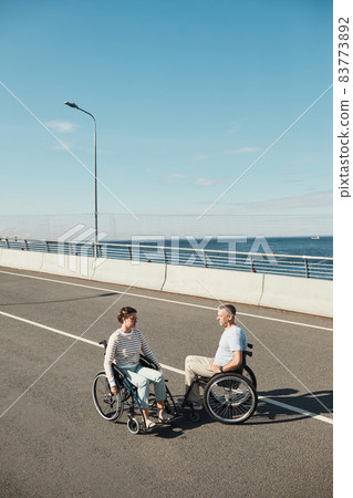 Couple in Wheelchairs Wide Angle Couple in Wheelchairs Wide Angle 83773892