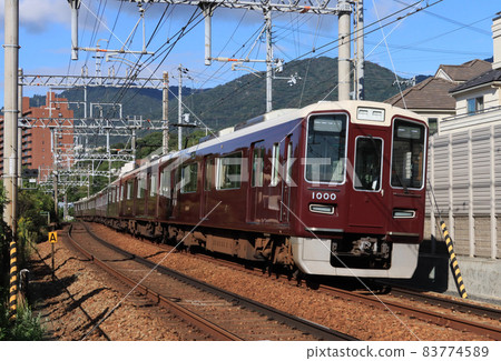 1000 series train running near Mikage Station on the Hankyu Kobe Line 83774589