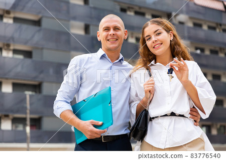Portrait of a happy young couple who received the keys to a flat 83776540