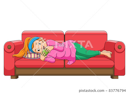 The girl is playing the phone on the sofa The girl is playing the phone on the sofa 83776794