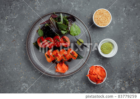 Japanese sushi -red dragon. Avocado, salmon and sushi cheese. Top view 83779259